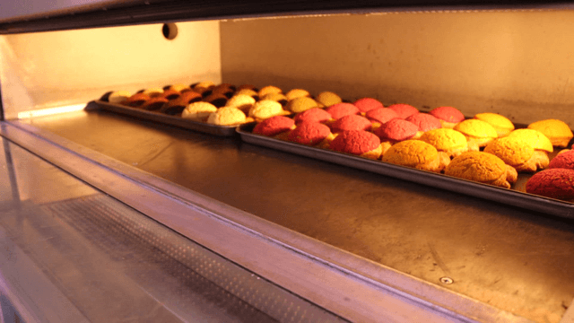 Colorful bread baking in an oven