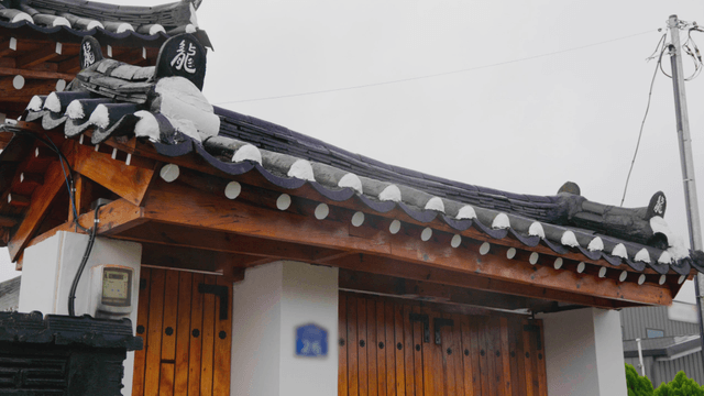 Traditional hanok with a wooden gate