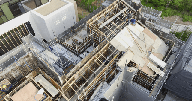Construction site with workers and scaffolding