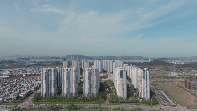 Cityscape with high-rise buildings and distant sea