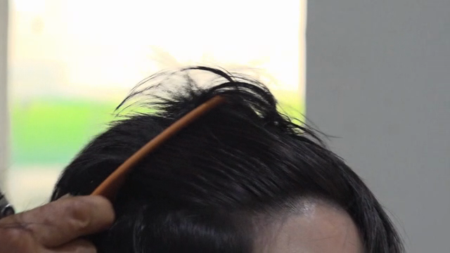 A person getting a haircut indoors
