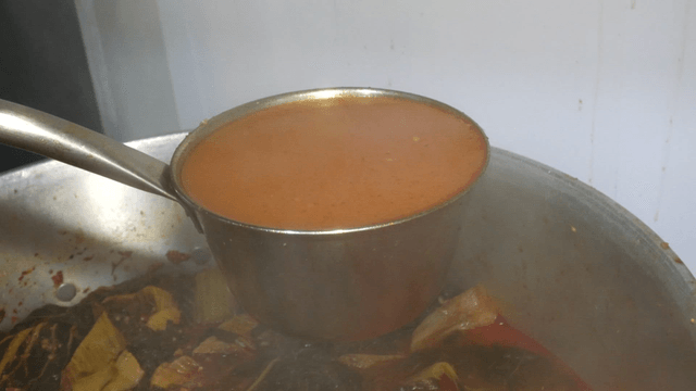 Rich outer leaves pork back-bone broth in a large pot