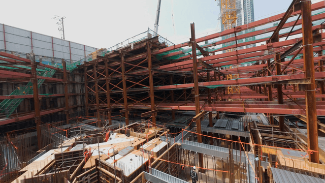 Construction site with scaffolding and beams