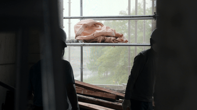 Construction workers inside a building
