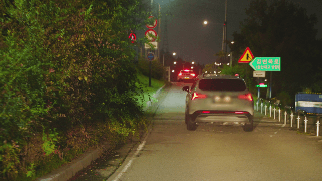 Night road with cars and streetlights