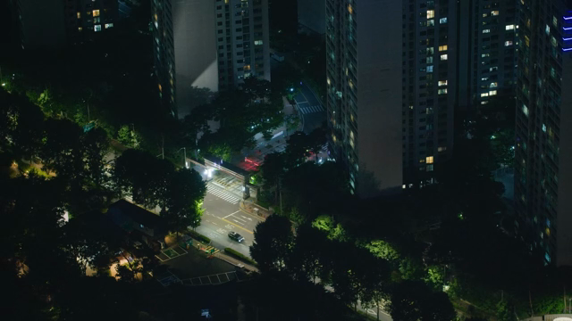 Night view of a city with tall buildings