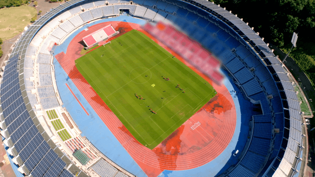 Aerial view of football players training on the field