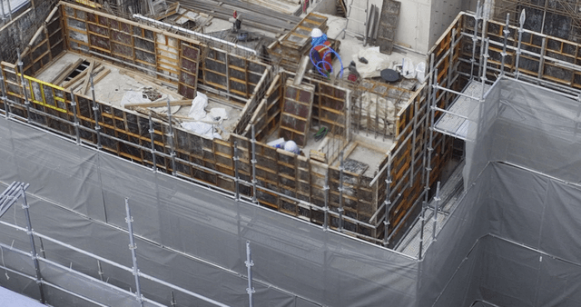 Construction workers building a structure