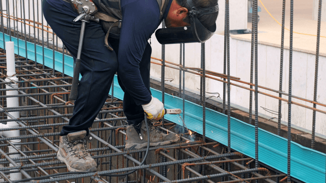 Worker welding at a construction site