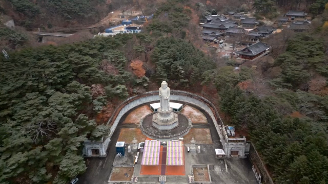 Aerial view of a Buddhist temple in a forest