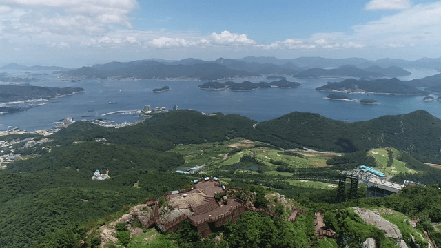Mountain top view with town and sea