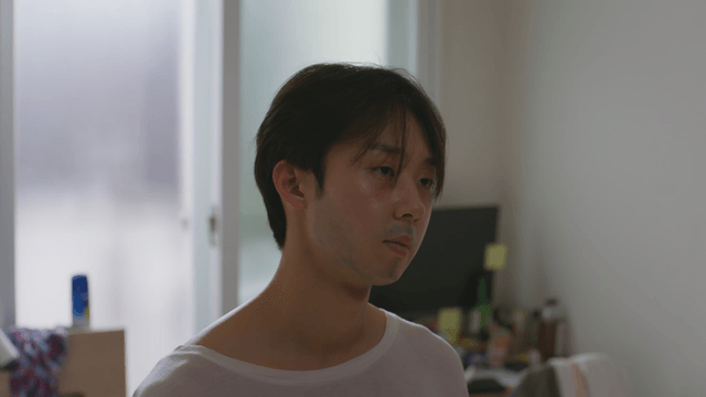 Man in a room looking contemplative