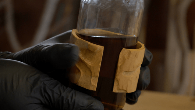 Hand holding a warm teacup