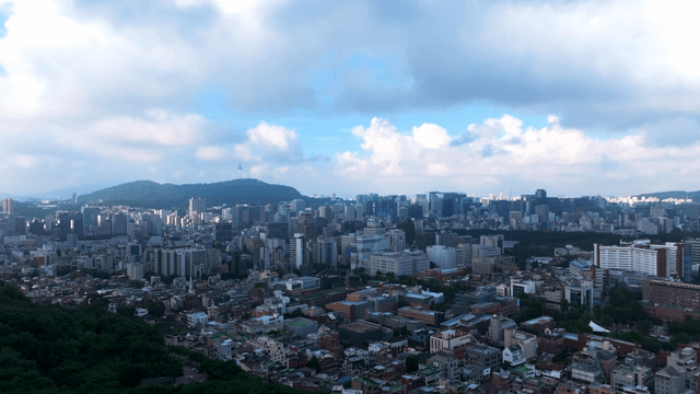 Sprawling cityscape with distant mountains