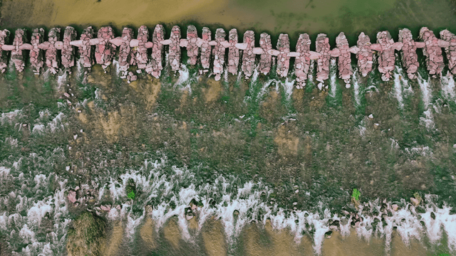Stone bridge across the river viewed from above