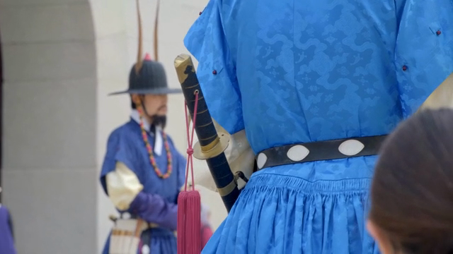 Traditional Korean chief gatekeeper in blue attire