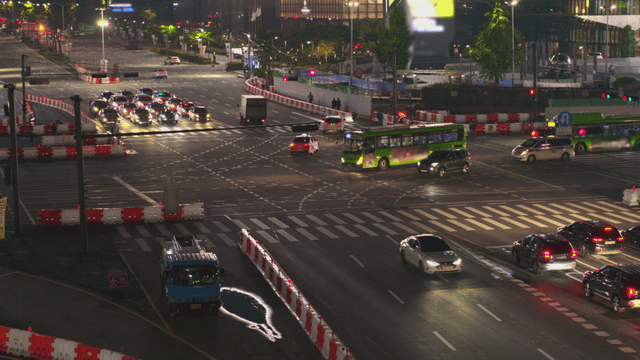 Busy intersection at night