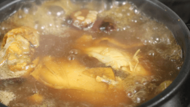 Phellinus linteus chicken soup boiling in a pot