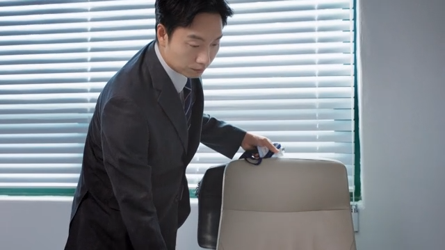 A businessman leaving the office after finishing work