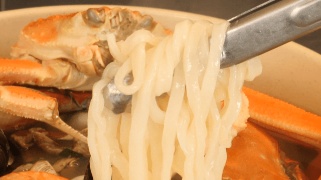 Crab and seafood in a noodle soup