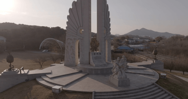 A monument with sculptures in a park