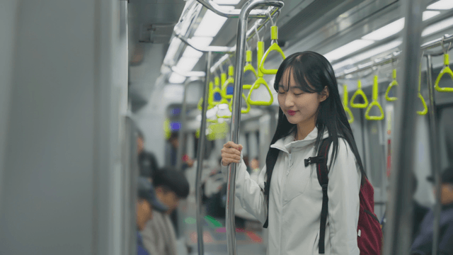Young woman in subway train