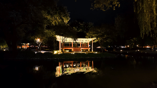 Traditional pavilion illuminated at night