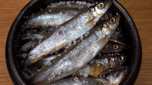Salted fish in a wooden bowl