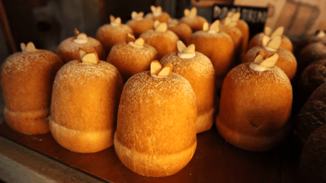 Various types of bread displayed on a bakery
