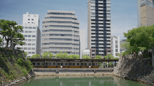 Train passing through a cityscape