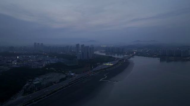 City skyline with river at dusk