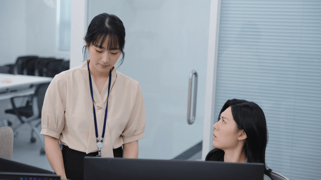 An employee being scolded by their boss after a report