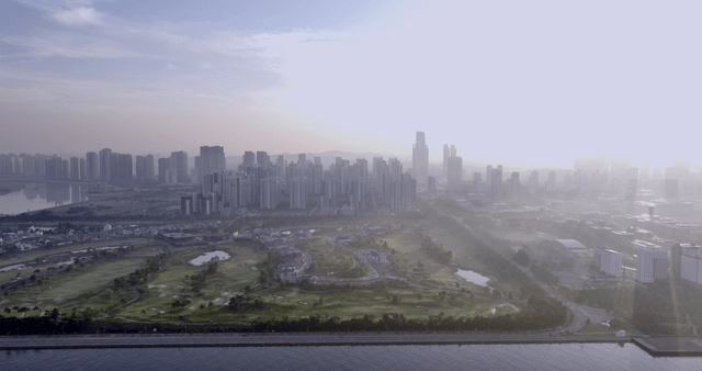 City skyline with a river and park