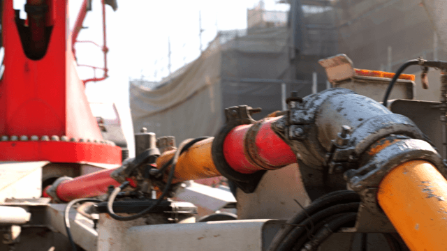 Concrete being poured into a mixer