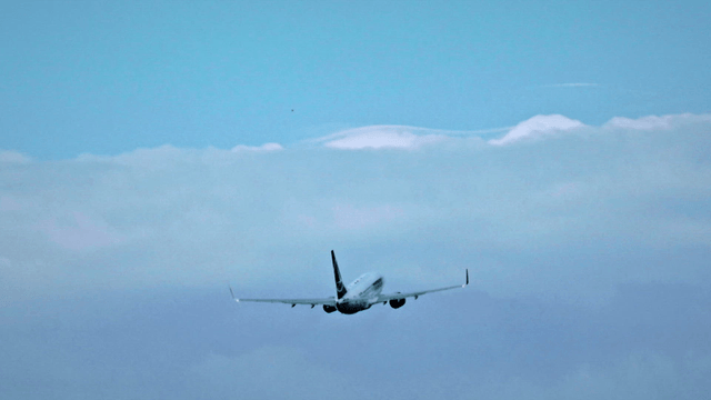 Airplane ascending into the sky