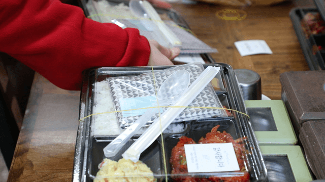 Korean lunch boxes being prepared