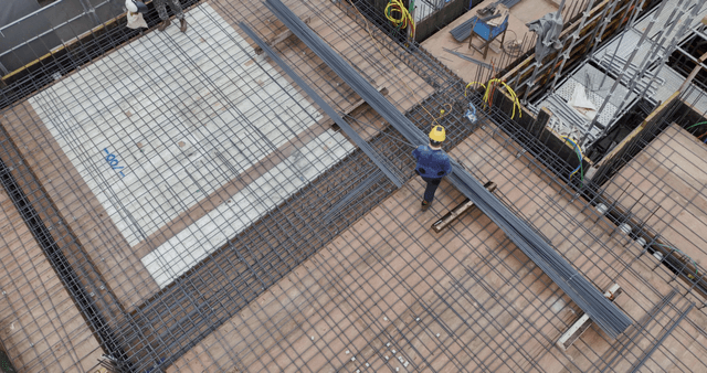 Construction site with workers and materials