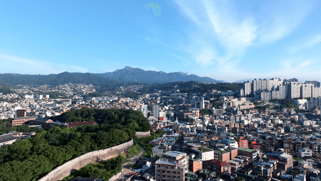 Sprawling cityscape with mountains