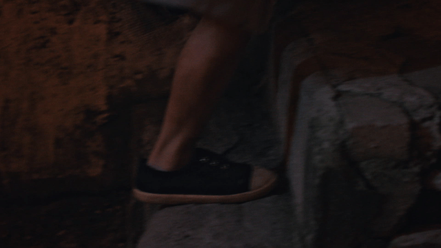 A person climbing stone steps