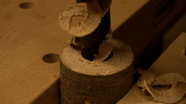 Drilling a wooden barrel slowly and precisely