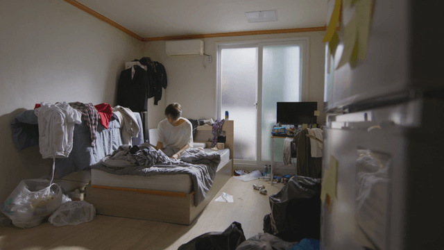 Person waking up in a messy room