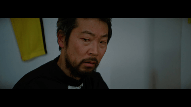 Man in a room looking intently