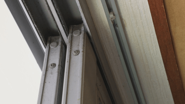 Close-up of a dirty window frame indoors