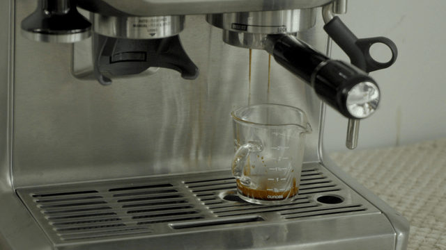 Espresso machine brewing coffee