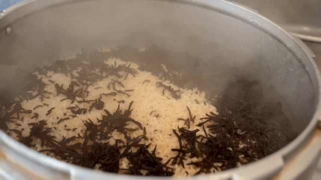 Jeju seaweed rice steaming inside a pressure cooker