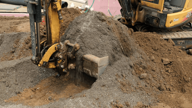 Construction site with excavator digging
