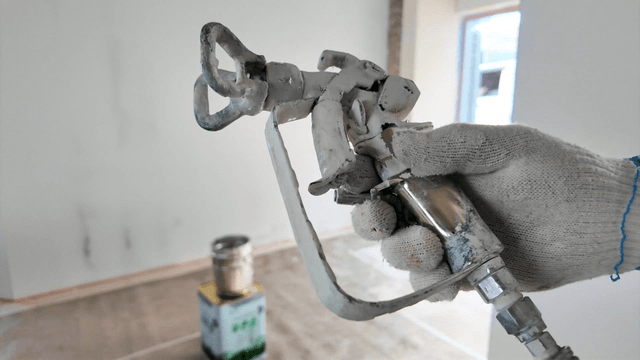 Paint spray gun at a painting site