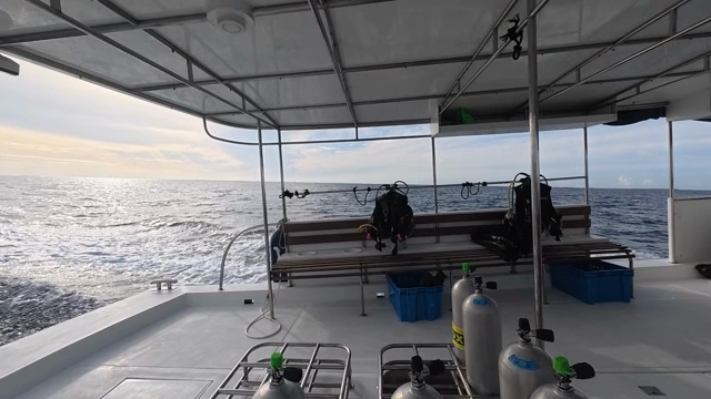 A boat with diving gear on the open sea