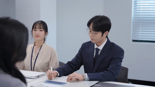 A meeting where the contract is being signed