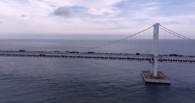 A large bridge connecting a modern city
